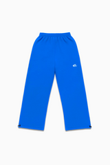 Flat lay of Cynique Basic Blue Jogger — oversized 100% cotton streetwear sweatpants with elastic waistband, adjustable cuffs, and embroidered logo