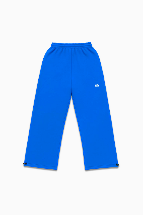 Flat lay of Cynique Basic Blue Jogger — oversized 100% cotton streetwear sweatpants with elastic waistband, adjustable cuffs, and embroidered logo