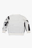 Back view of Cynique Monarch Knit sweater — black and white jacquard crewneck with minimal rear design, made from cotton, wool, and cashmere blend