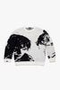 Flat lay of Cynique Monarch Knit sweater — black and white jacquard crewneck featuring abstract portrait design, made with cotton, wool, and cashmere blend