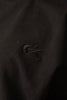Close-up of tonal embroidered Cynique logo on Vanta Black Tee — detailed view of black-on-black stitching on 100% cotton streetwear T-shirt