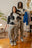 Le pull Monarch Knit de Cynique porté en duo : unisexe, oversize et audacieux. Tricot en maille épaisse blanc cassé et noir, avec visages graphiques tissés en all-over. Silhouette ample, coupe boxy et finition côtelée. Pièce forte de la collection hiver, idéale pour un style streetwear affirmé et artistique. Parfait pour homme comme pour femme.